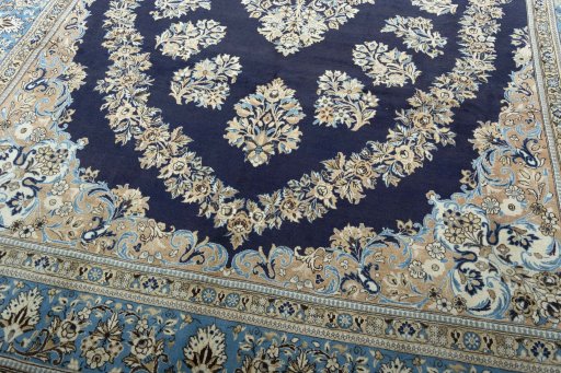 Close-up detail of 2000s Ghom rug from Iran / Persia showing Wool weave