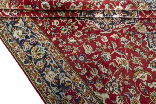 Close-up detail of 2000s Ghom rug from Iran / Persia showing Wool weave