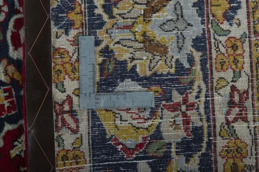 Backside of handmade 2000s Ghom rug showing knot structure and weave density