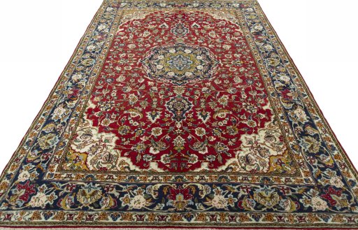 Surface texture of 2000s Ghom rug with natural Wool and intricate pattern