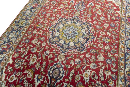 Backside of handmade 2000s Ghom rug showing knot structure and weave density