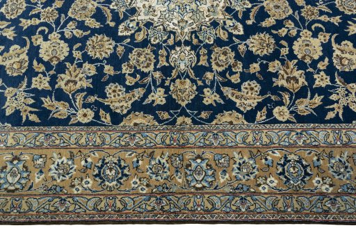 Corner detail of 1950s Ghom rug showing border pattern and Cork pile