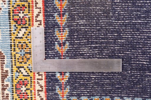 Corner detail of 2001s Ghom rug showing border pattern and Wool pile