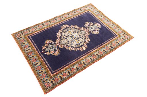 Corner detail of 2001s Ghom rug showing border pattern and Wool pile