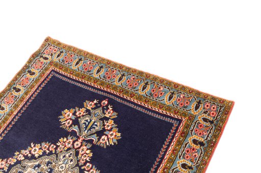 Surface texture of 2001s Ghom rug with natural Wool and intricate pattern