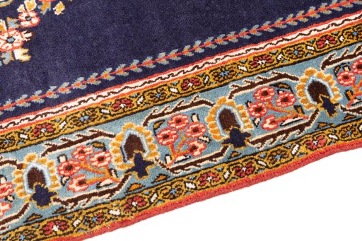 Backside of handmade 2001s Ghom rug showing knot structure and weave density