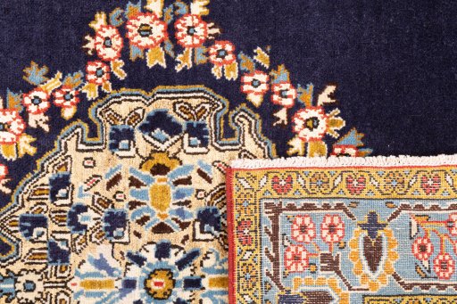 Close-up detail of 2001s Ghom rug from Iran / Persia showing Wool weave