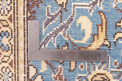 Corner detail of 1999s Ghom rug showing border pattern and Wool pile