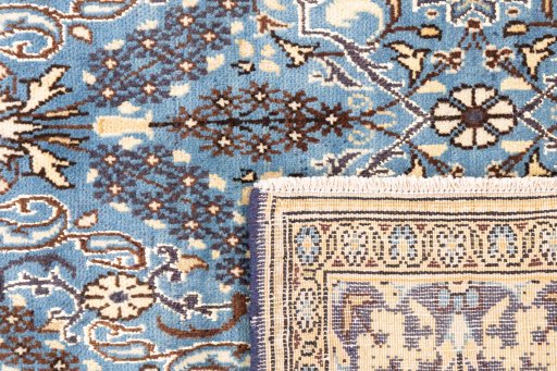 Close-up detail of 1999s Ghom rug from Iran / Persia showing Wool weave