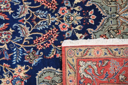 Close-up detail of 1980s Ghom rug from Iran / Persia showing Wool weave