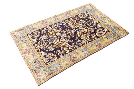 Corner detail of 2001s Ghom rug showing border pattern and Wool pile