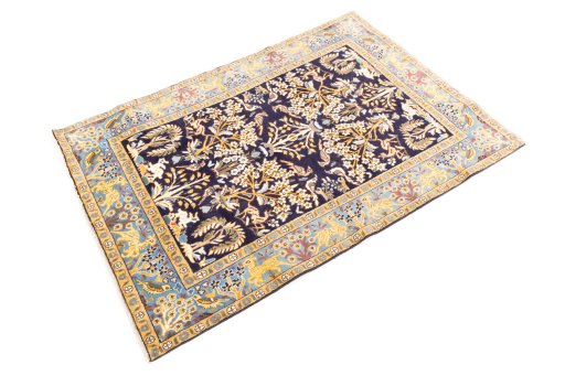 Close-up detail of 2001s Ghom rug from Iran / Persia showing Wool weave