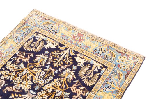 Surface texture of 2001s Ghom rug with natural Wool and intricate pattern
