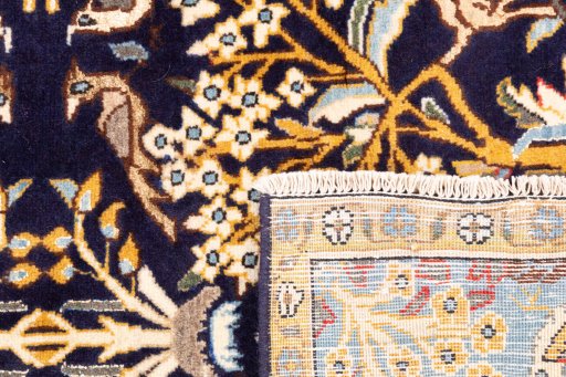 Close-up detail of 2001s Ghom rug from Iran / Persia showing Wool weave
