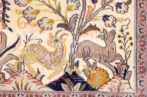 Corner detail of 2000s Ghom rug showing border pattern and Wool pile