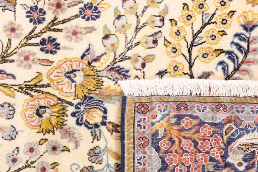 Close-up detail of 2000s Ghom rug from Iran / Persia showing Wool weave