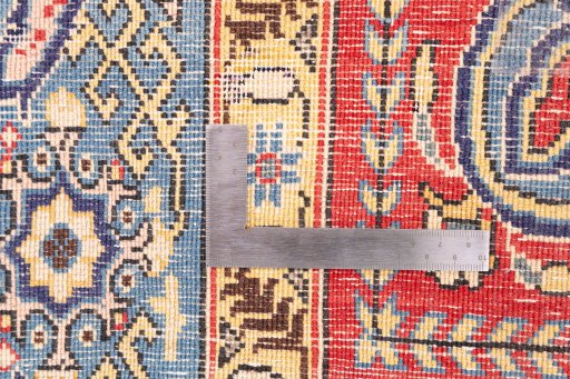 Corner detail of 1970s Ghom rug showing border pattern and Wool pile