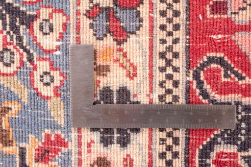 Close-up detail of 1988s Ghom rug from Iran / Persia showing Wool weave