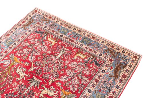 Surface texture of 1988s Ghom rug with natural Wool and intricate pattern