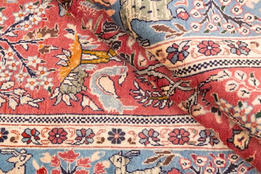 Corner detail of 1975s Ghom rug showing border pattern and Wool pile