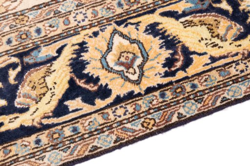 Backside of handmade 1970s Ghom rug showing knot structure and weave density