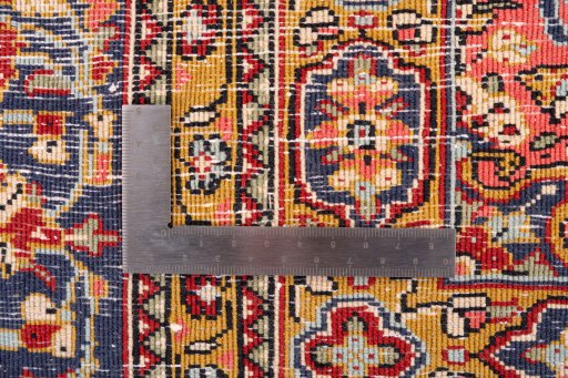 Corner detail of 1972s Ghom rug showing border pattern and Wool pile