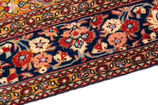 Backside of handmade 1972s Ghom rug showing knot structure and weave density