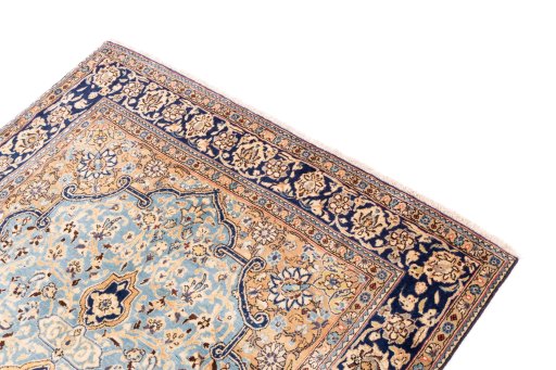 Surface texture of 1975s Ghom rug with natural Wool and intricate pattern