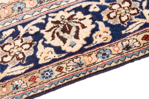 Backside of handmade 1975s Ghom rug showing knot structure and weave density