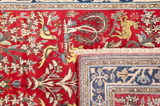 Close-up detail of 1985s Ghom rug from Iran / Persia showing Wool weave