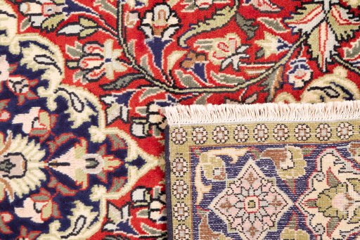 Close-up detail of 1979s Ghom rug from Iran / Persia showing Wool weave