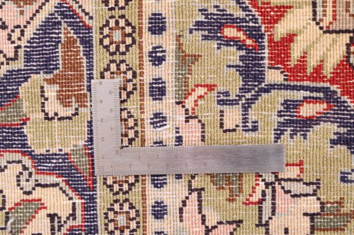 Corner detail of 1979s Ghom rug showing border pattern and Wool pile