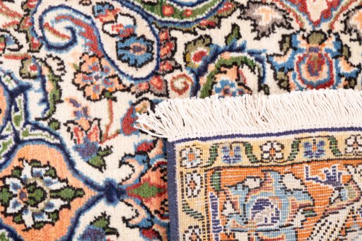 Close-up detail of 1998s Ghom rug from Iran / Persia showing Wool weave