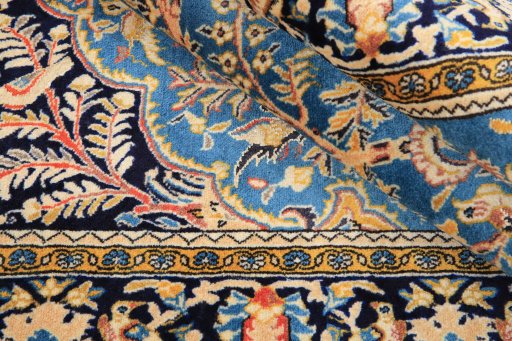 Corner detail of 1990s Ghom rug showing border pattern and Wool pile
