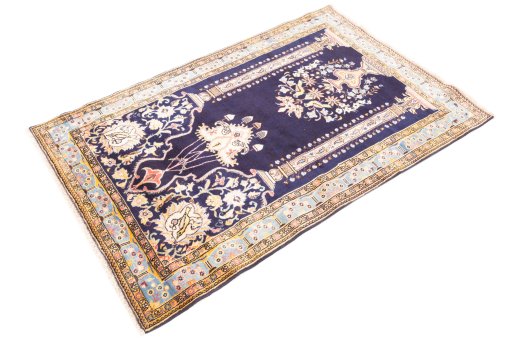 Corner detail of 1995s Ghom rug showing border pattern and Wool pile