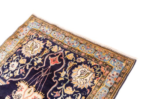Surface texture of 1995s Ghom rug with natural Wool and intricate pattern