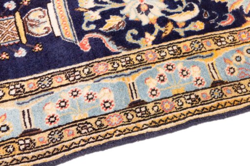 Backside of handmade 1995s Ghom rug showing knot structure and weave density