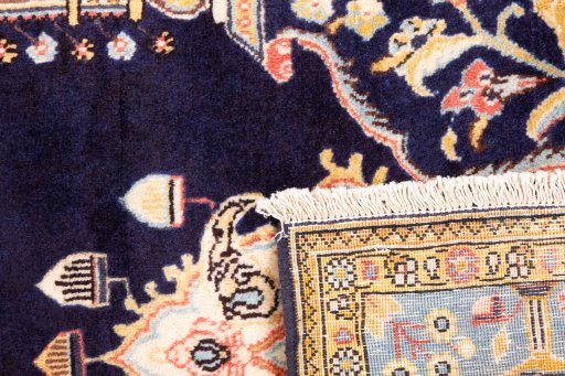 Close-up detail of 1995s Ghom rug from Iran / Persia showing Wool weave