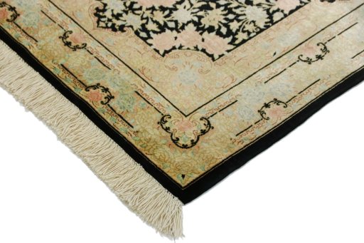 Backside of handmade New Ghom rug showing knot structure and weave density