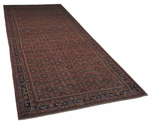 Corner detail of 2000s Hoseinabad rug showing border pattern and Wool pile