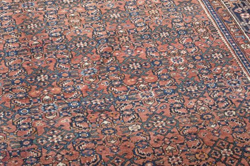Backside of handmade 2000s Hoseinabad rug showing knot structure and weave density