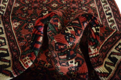 Corner detail of 2000s Hoseinabad rug showing border pattern and Wool pile