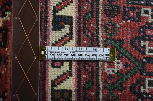 Close-up detail of 2000s Hoseinabad rug from Iran / Persia showing Wool weave