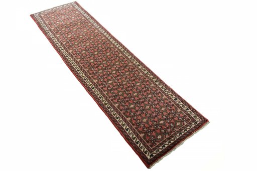 Close-up detail of 2000s Hoseinabad rug from Iran / Persia showing Wool weave