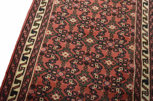 Backside of handmade 2000s Hoseinabad rug showing knot structure and weave density
