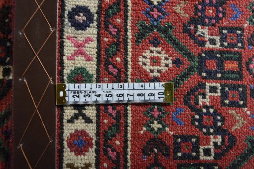Close-up detail of 2000s Hoseinabad rug from Iran / Persia showing Wool weave