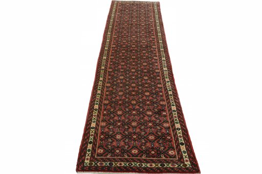 Surface texture of 2000s Hoseinabad rug with natural Wool and intricate pattern