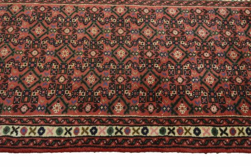 Close-up detail of 2000s Hoseinabad rug from Iran / Persia showing Wool weave