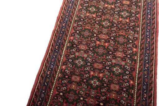 Backside of handmade New Hoseinabad rug showing knot structure and weave density