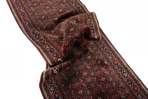 Corner detail of New Hoseinabad rug showing border pattern and Wool pile